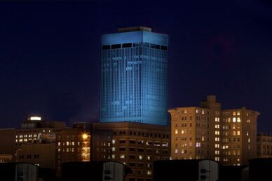 WoodmenLife Tower lit in blue
