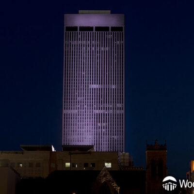 WoodmenLife Tower lit in purple