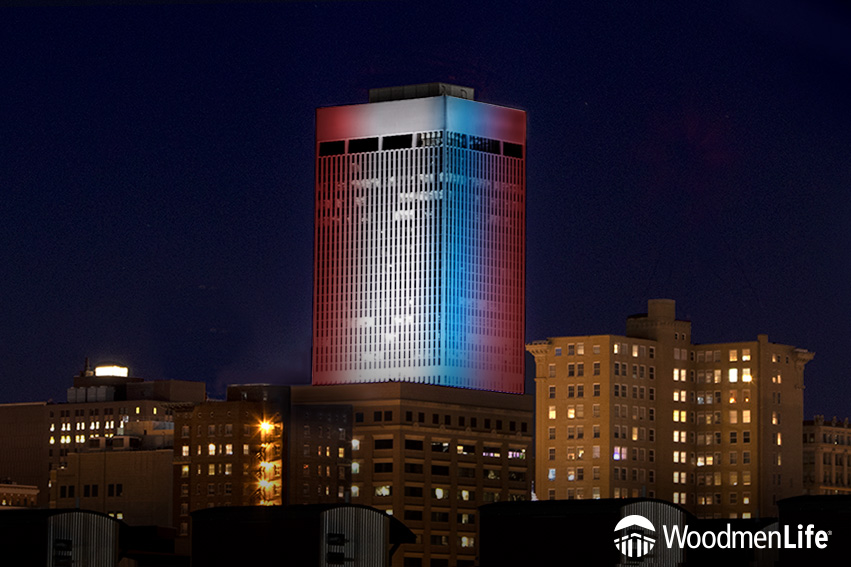 WoodmenLife Tower in red, white and blue