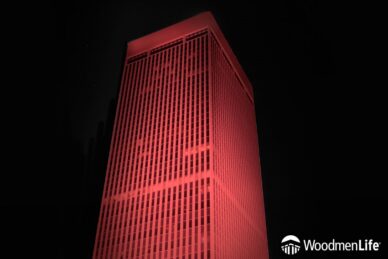 WoodmenLife Tower glowing red