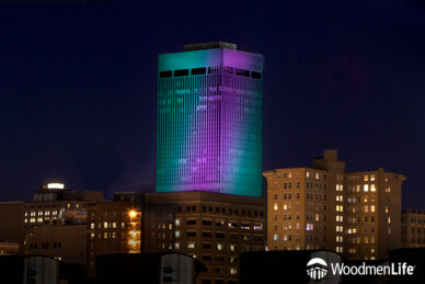 WoodmenLife Tower in Teal and Purple