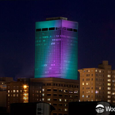 WoodmenLife Tower in Teal and Purple