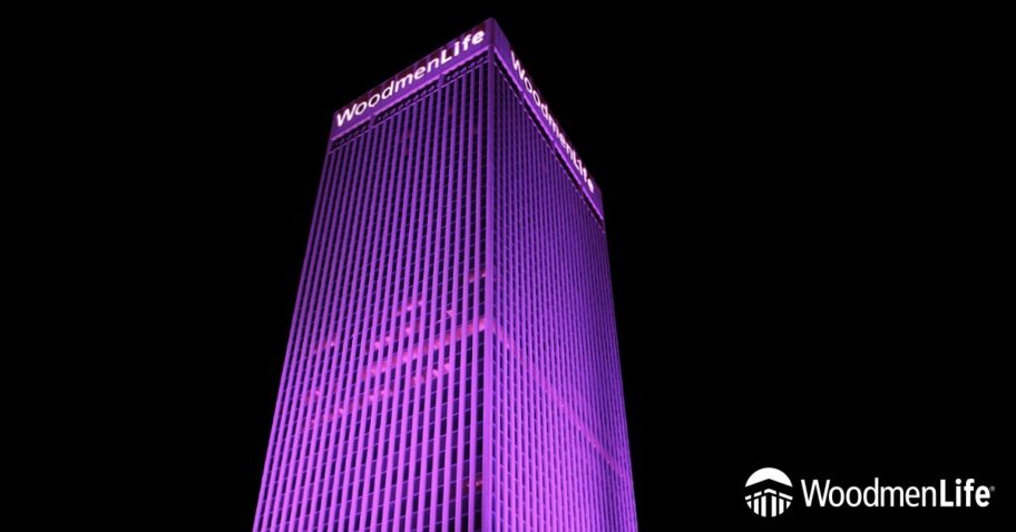 WoodmenLife Tower lit in purple