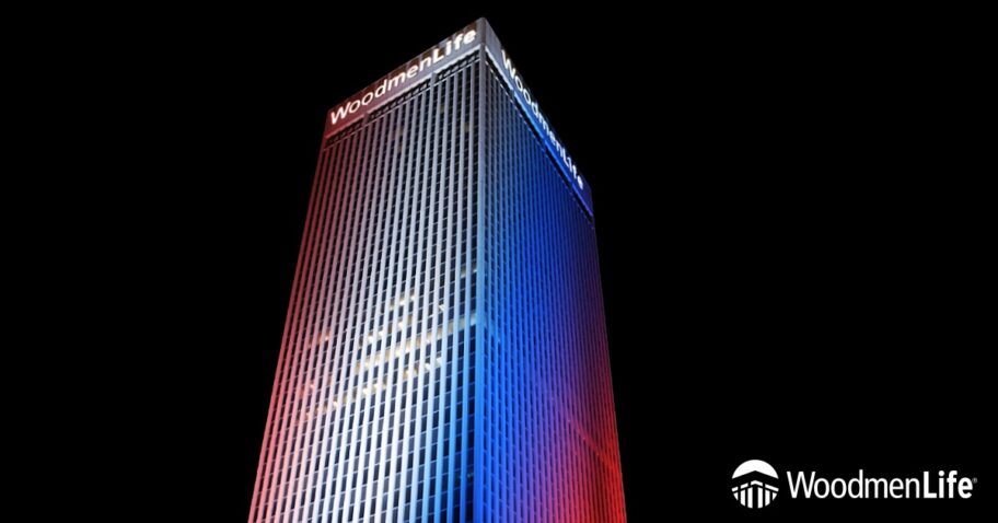 WoodmenLife Tower lit in red, white and blue