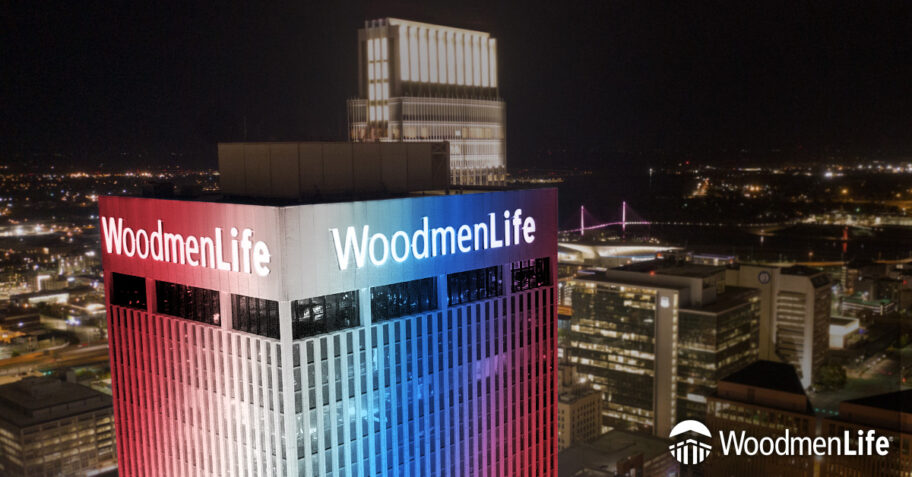 WoodmenLife Tower lit in red, white and blue